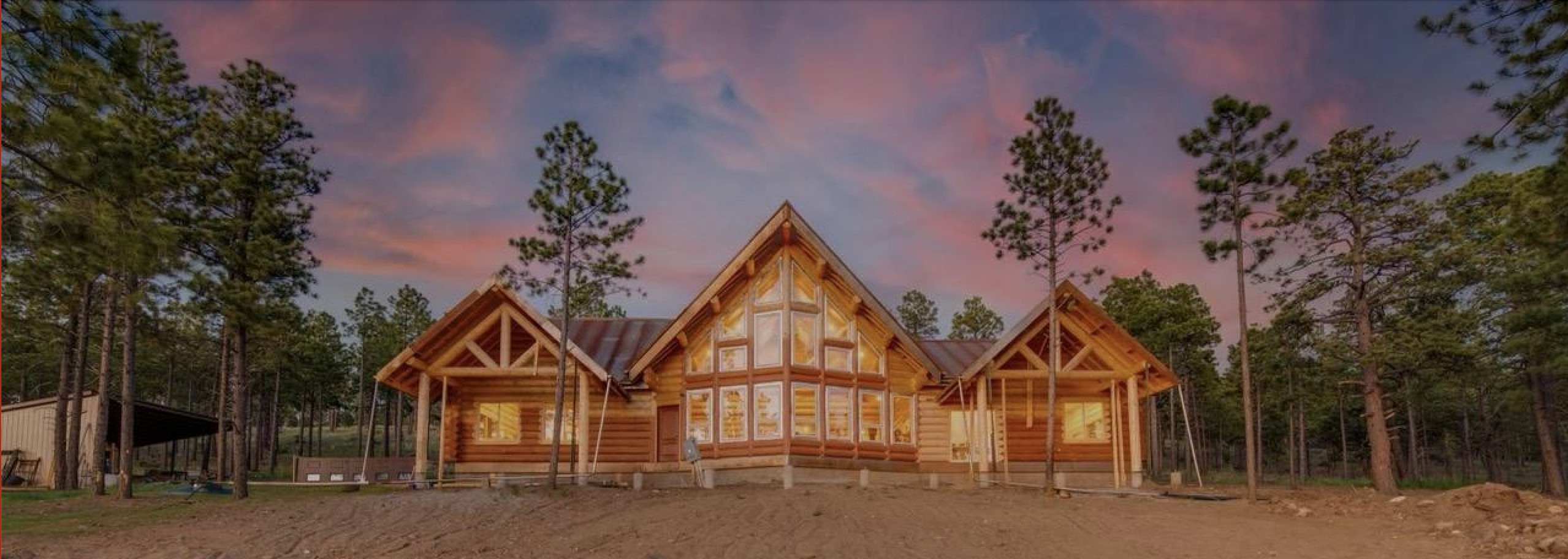 milled log home in Arizona at sunet